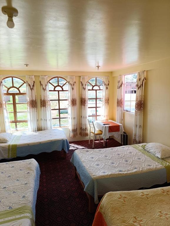 Postel nebo postele na pokoji v ubytování Hotel Summita