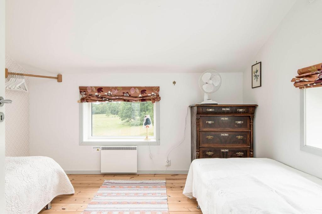 Postel nebo postele na pokoji v ubytování Häradssätter Gård 1