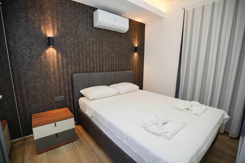 Postel nebo postele na pokoji v ubytování Sofia Residence
