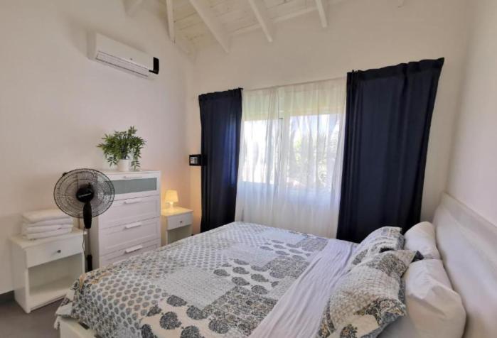 Postel nebo postele na pokoji v ubytování CARIBBEAN DREAM Villas & Apartments ocean view Playa LOS CORALES