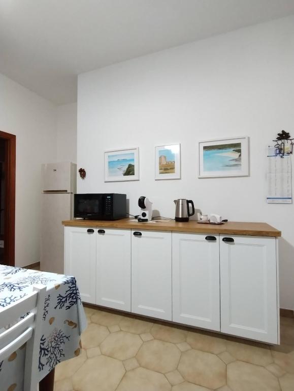 Kuchyň nebo kuchyňský kout v ubytování Teulada Rustic Charm 5