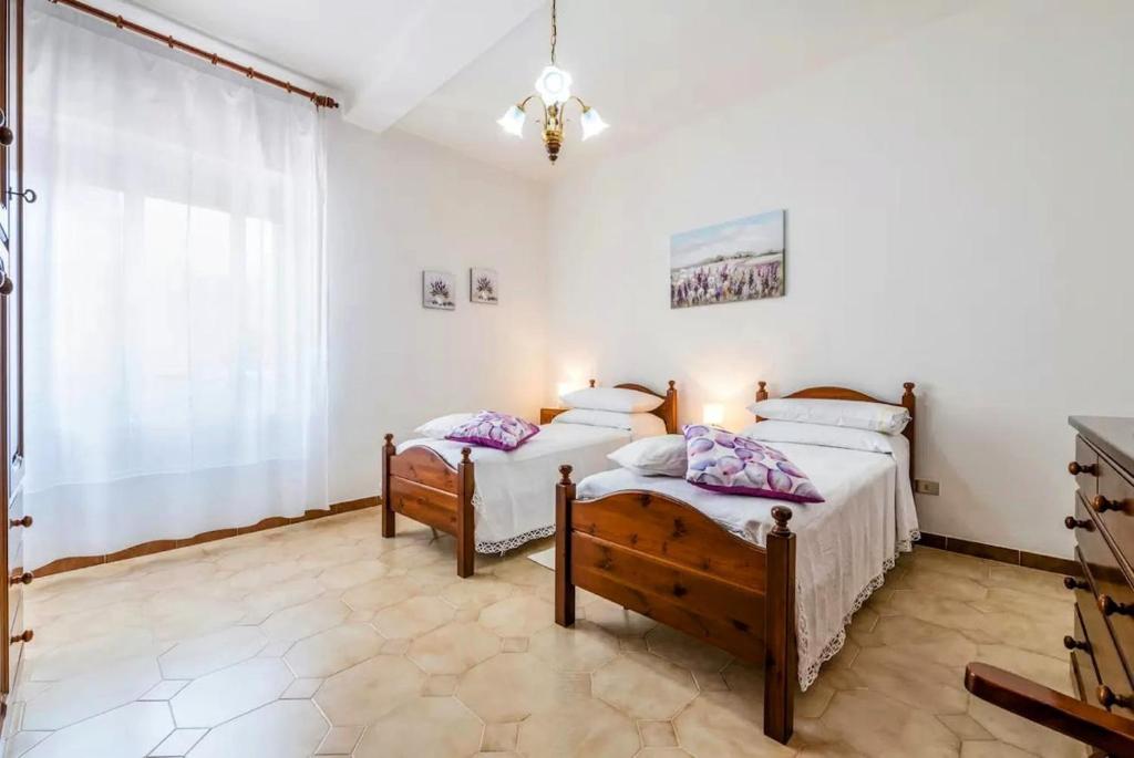Postel nebo postele na pokoji v ubytování Teulada Rustic Charm 5