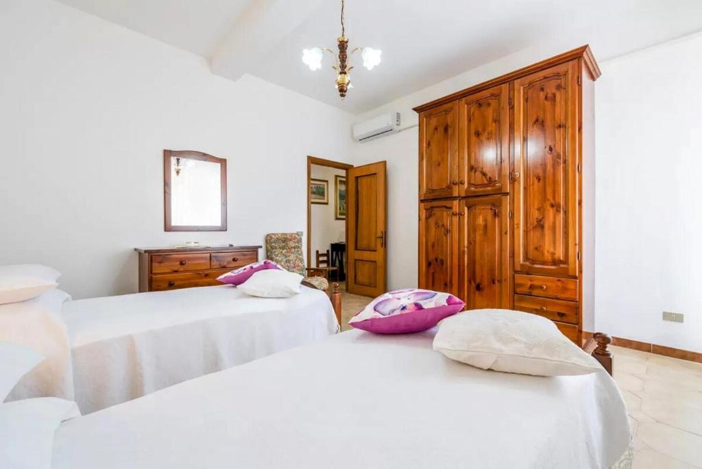 Postel nebo postele na pokoji v ubytování Teulada Rustic Charm 5