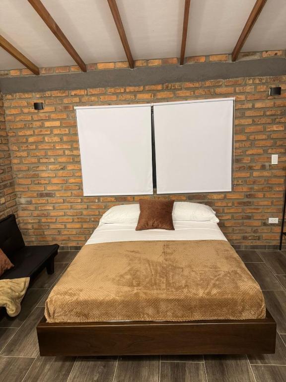 Postel nebo postele na pokoji v ubytování Cabañas La Sanguina, Loft S2