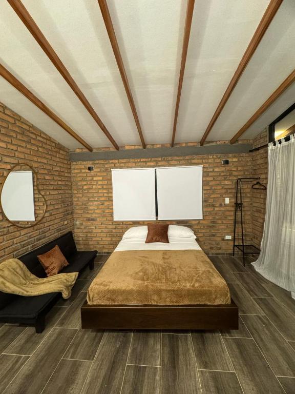 Postel nebo postele na pokoji v ubytování Cabañas La Sanguina, Loft S2
