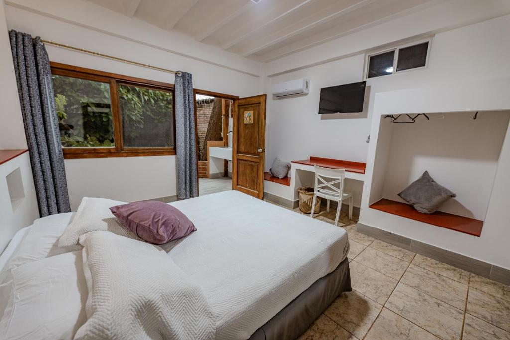 Postel nebo postele na pokoji v ubytování Hotel Nantu Hostería