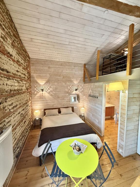 Postel nebo postele na pokoji v ubytování Le Duplex de l'Artisterie