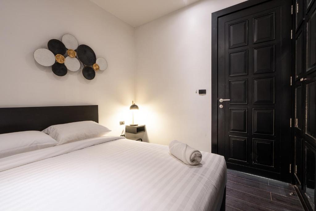 Postel nebo postele na pokoji v ubytování Coco Pool Villa