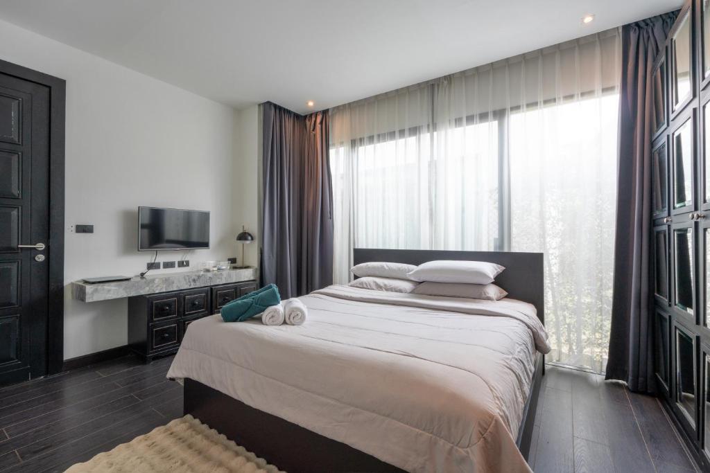 Postel nebo postele na pokoji v ubytování Coco Pool Villa