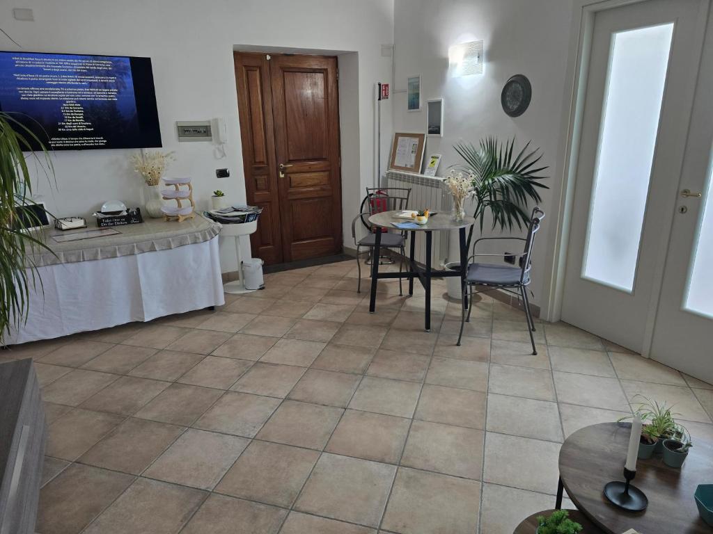 Televízia a/alebo spoločenská miestnosť v ubytovaní Itaca B&B