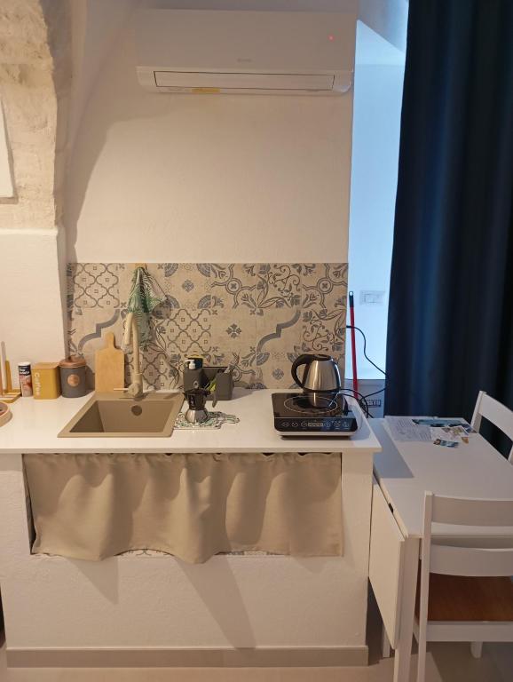 Kuchyň nebo kuchyňský kout v ubytování B&b La Fontana