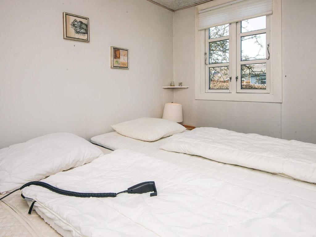 Postel nebo postele na pokoji v ubytování 4 person holiday home in Haderslev