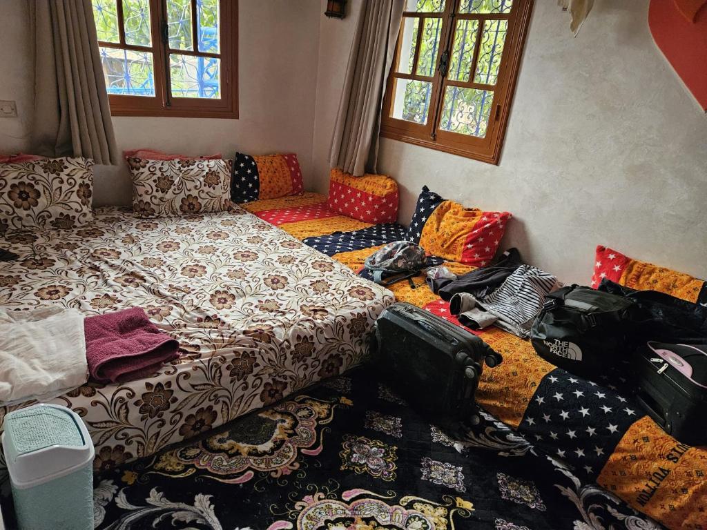 Postel nebo postele na pokoji v ubytování Dar Imoughlad