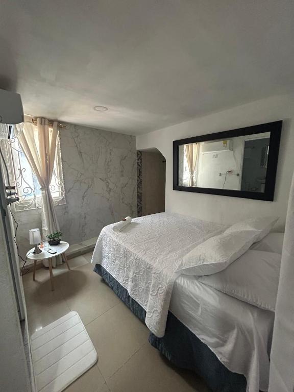 Postel nebo postele na pokoji v ubytování Hostal Casa de las Americas