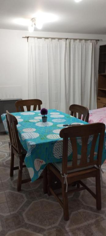 a dining room table with two chairs and a blue and white table cloth at Dulce Adelina II Zona Céntrica in Río Grande