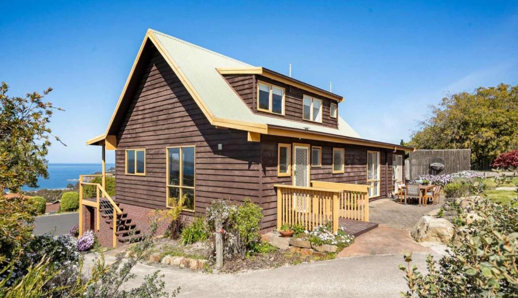 a small house with a view of the ocean at Ocean Views 20kms from CBD Sleeps 10 in Kingston Beach