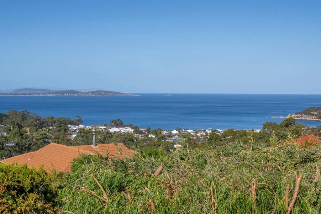 a view of the ocean from the top of a hill at Ocean Views 20kms from CBD Sleeps 10 in Kingston Beach