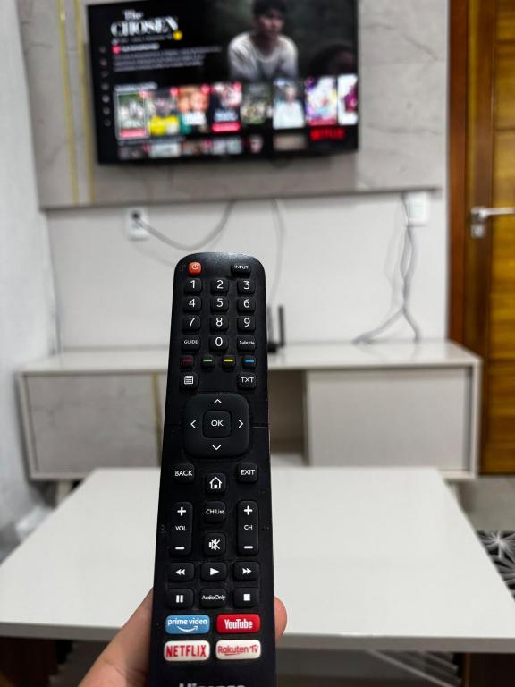 TV a/nebo společenská místnost v ubytování Casa elegante, próximo às cataratas
