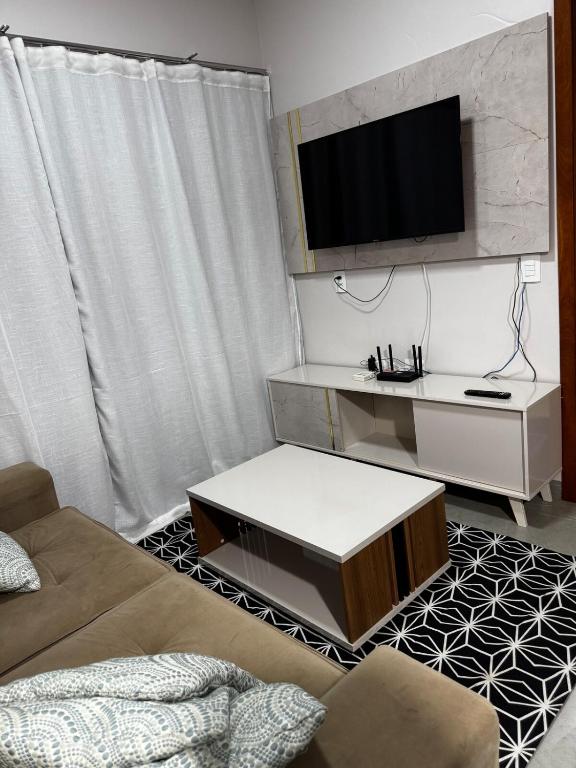 TV a/nebo společenská místnost v ubytování Casa elegante, próximo às cataratas
