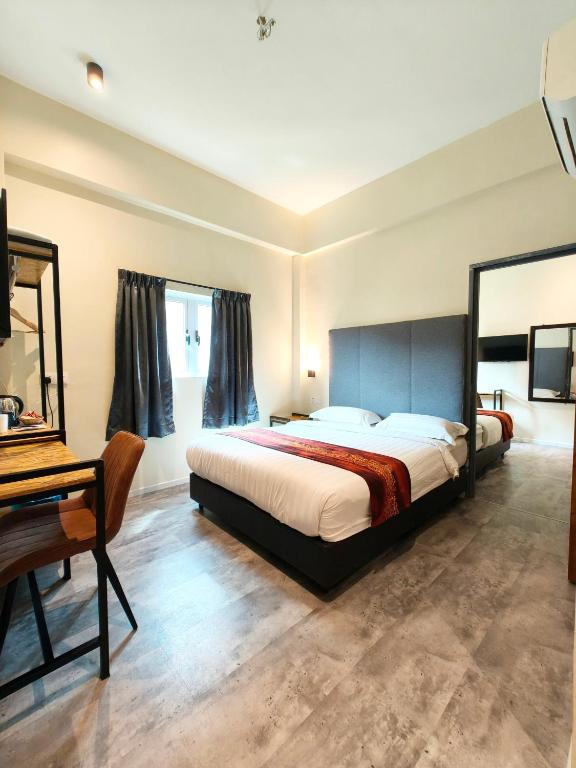 Postel nebo postele na pokoji v ubytování Pangkor Pop Ash Hotel