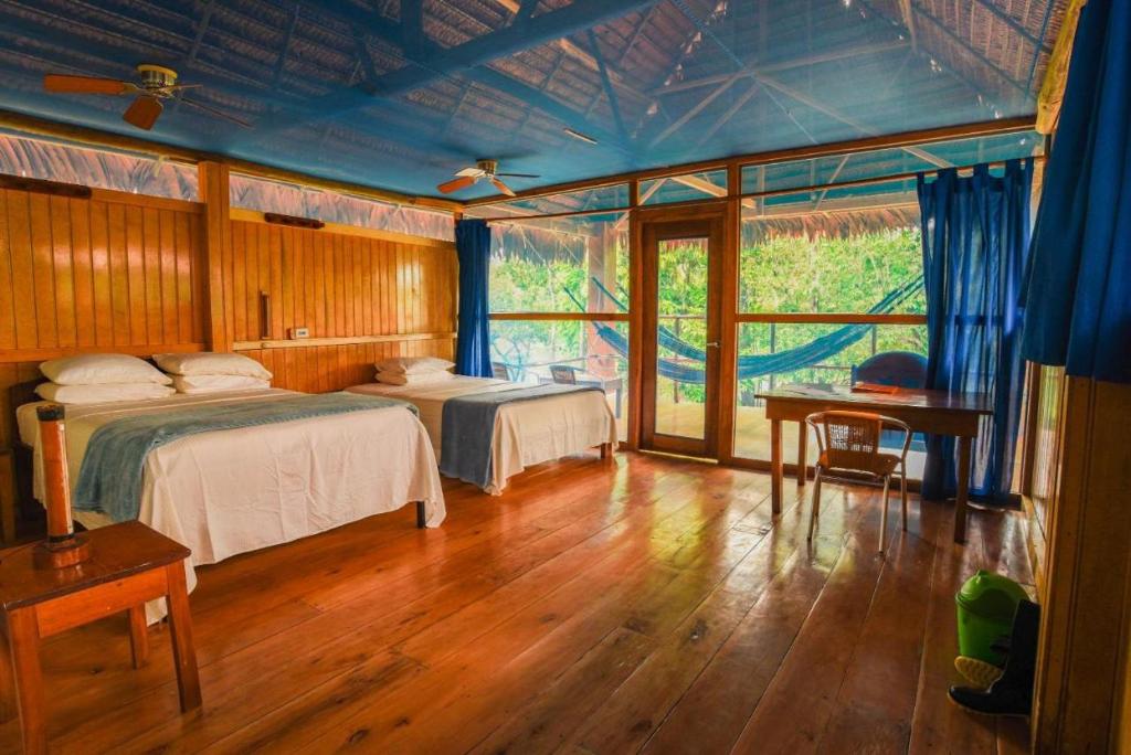 Postel nebo postele na pokoji v ubytování Amazon Muyuna Lodge - All Inclusive