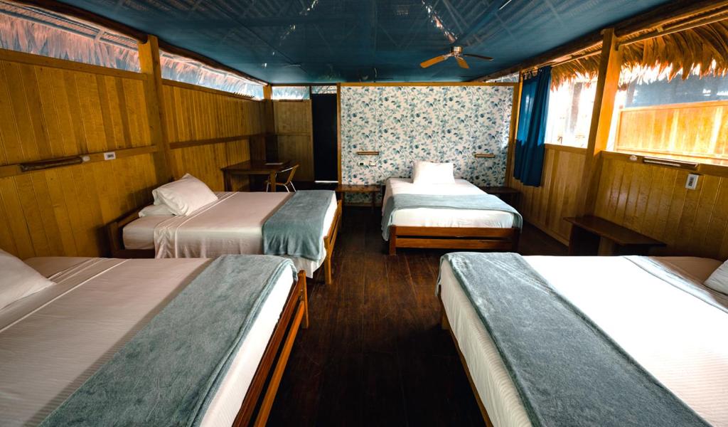 Postel nebo postele na pokoji v ubytování Amazon Muyuna Lodge - All Inclusive