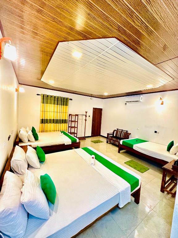 Postel nebo postele na pokoji v ubytování Ceylon Safari Cottage