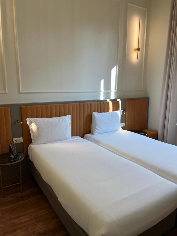 Postel nebo postele na pokoji v ubytování Hotel Duca D'Aosta