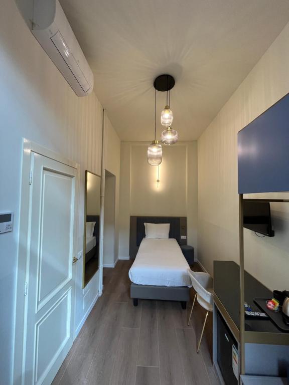 Postel nebo postele na pokoji v ubytování Hotel Duca D'Aosta