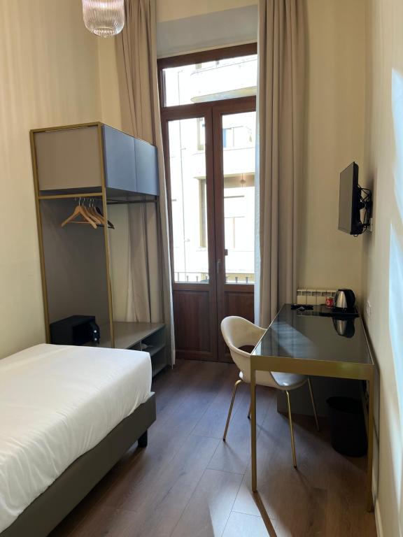 Postel nebo postele na pokoji v ubytování Hotel Duca D'Aosta