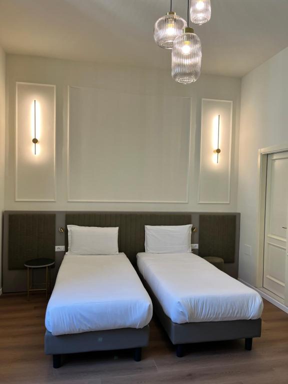 Postel nebo postele na pokoji v ubytování Hotel Duca D'Aosta