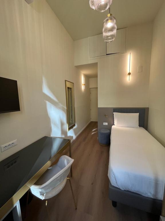 Postel nebo postele na pokoji v ubytování Hotel Duca D'Aosta