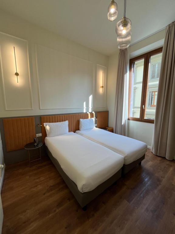 Postel nebo postele na pokoji v ubytování Hotel Duca D'Aosta