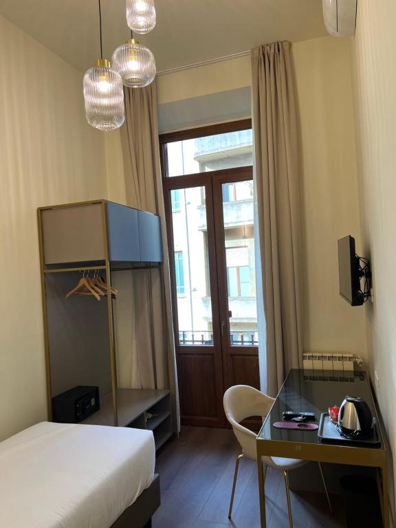 Postel nebo postele na pokoji v ubytování Hotel Duca D'Aosta