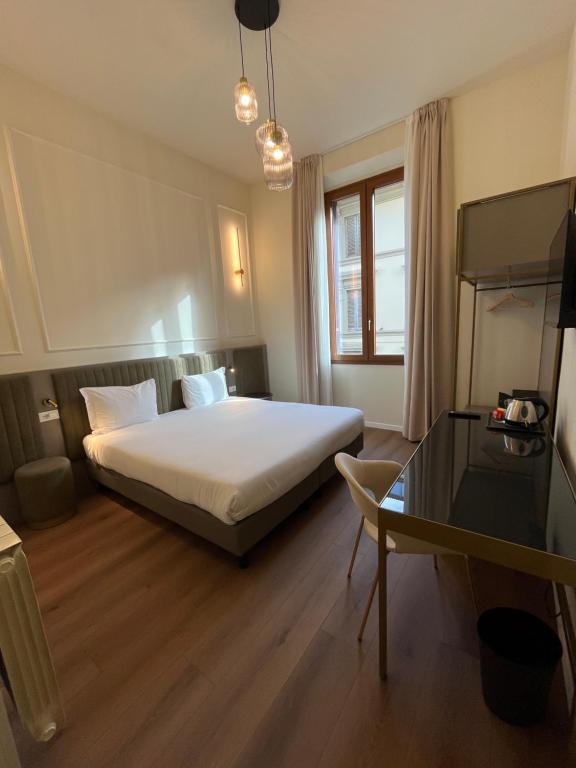 Postel nebo postele na pokoji v ubytování Hotel Duca D'Aosta