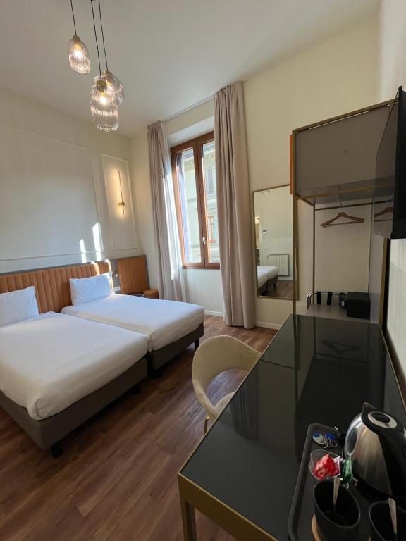 Postel nebo postele na pokoji v ubytování Hotel Duca D'Aosta