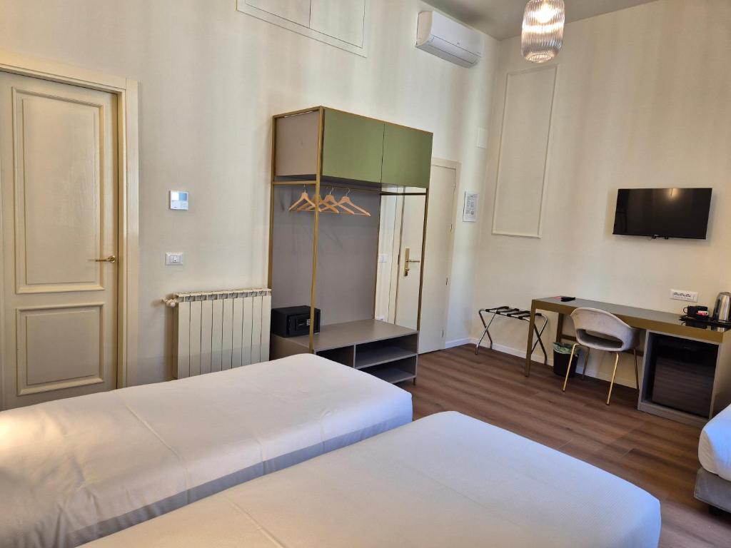 Postel nebo postele na pokoji v ubytování Hotel Duca D'Aosta