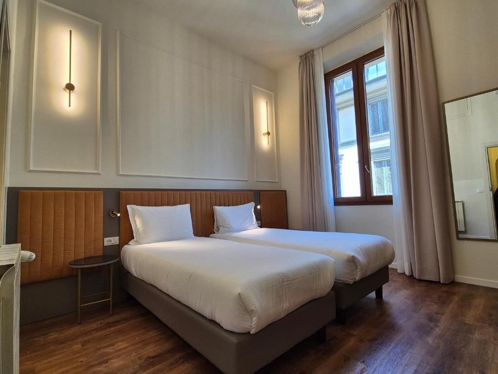 Postel nebo postele na pokoji v ubytování Hotel Duca D'Aosta