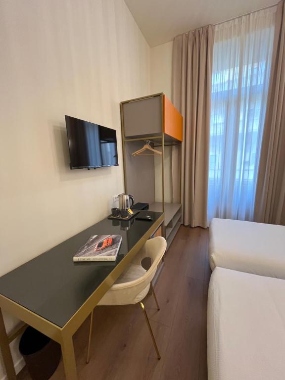 TV a/nebo společenská místnost v ubytování Hotel Duca D'Aosta