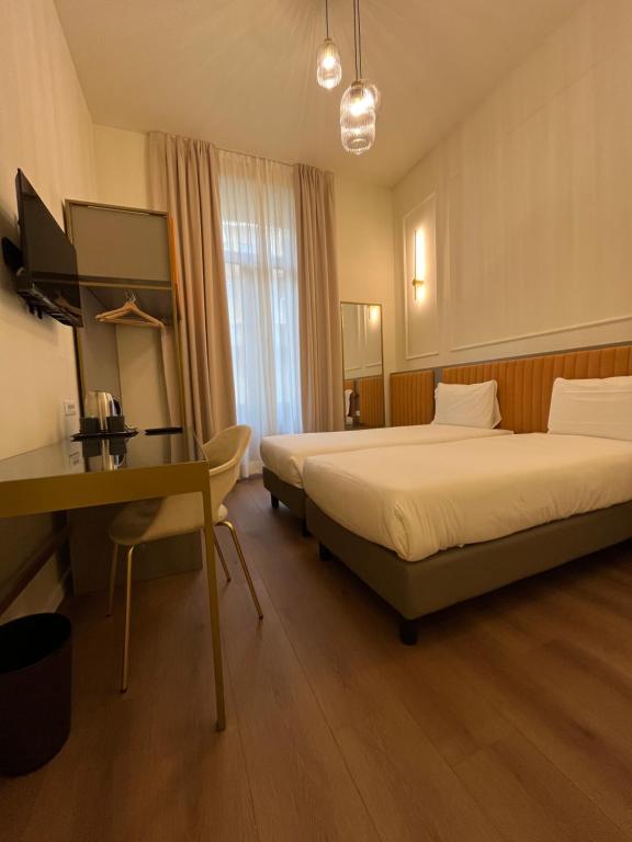 Postel nebo postele na pokoji v ubytování Hotel Duca D'Aosta