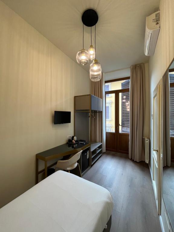 TV a/nebo společenská místnost v ubytování Hotel Duca D'Aosta