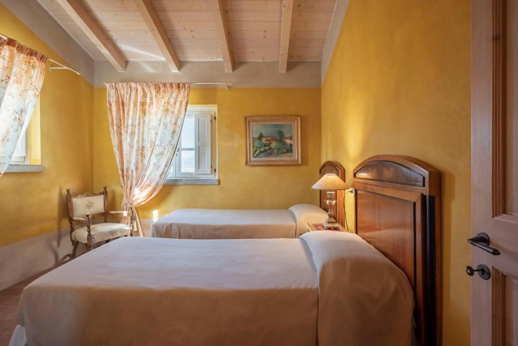 Postel nebo postele na pokoji v ubytování Guadalupe Tuscany Resort
