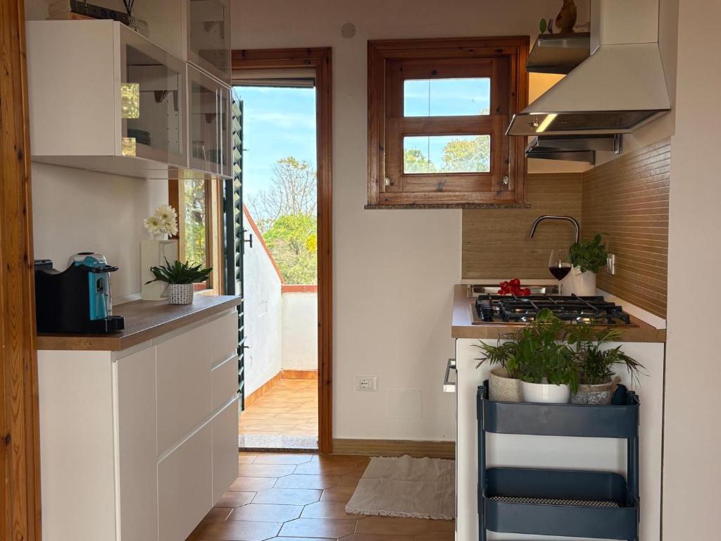 Kuchyň nebo kuchyňský kout v ubytování Bedda Casa Al Mare