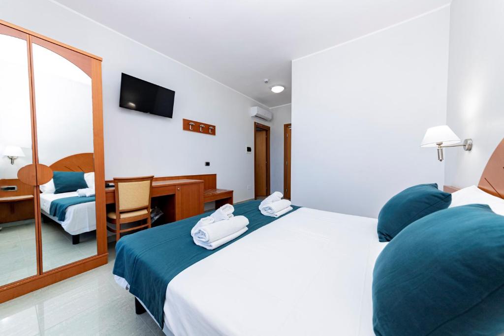 TV a/nebo společenská místnost v ubytování Hotel Alba