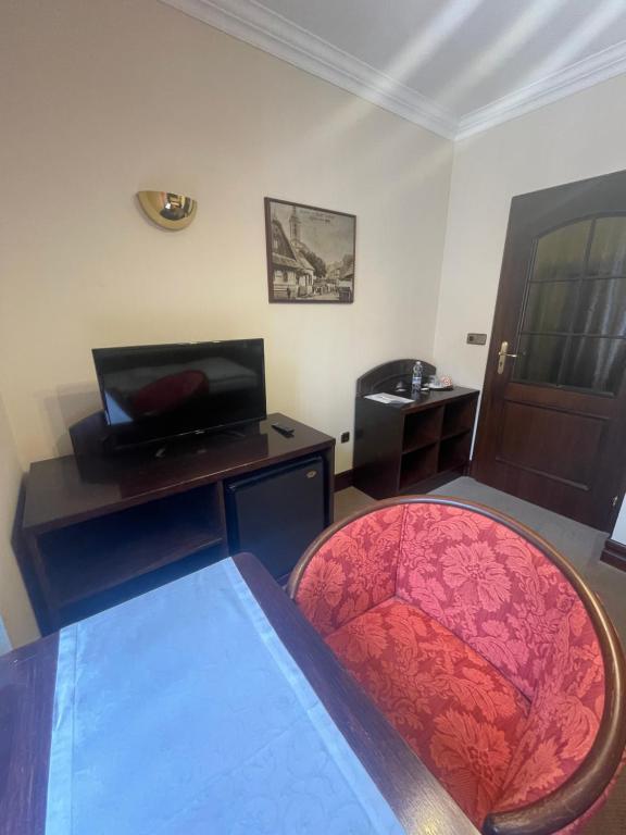TV a/nebo společenská místnost v ubytování Hotel Bravo