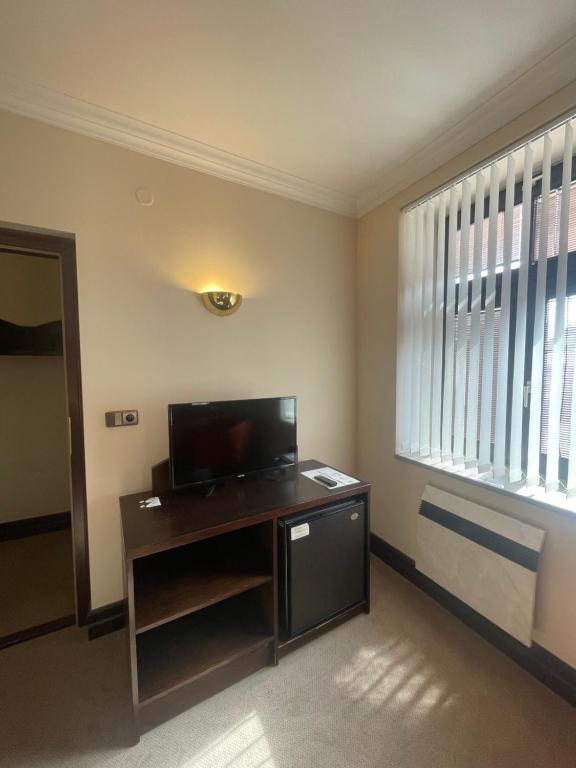 TV a/nebo společenská místnost v ubytování Hotel Bravo