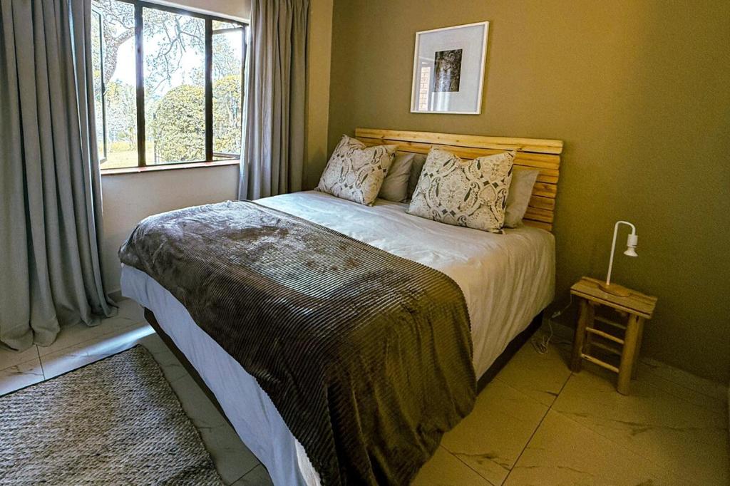 Ένα ή περισσότερα κρεβάτια σε δωμάτιο στο 31 Greenway Woods Ease and Style