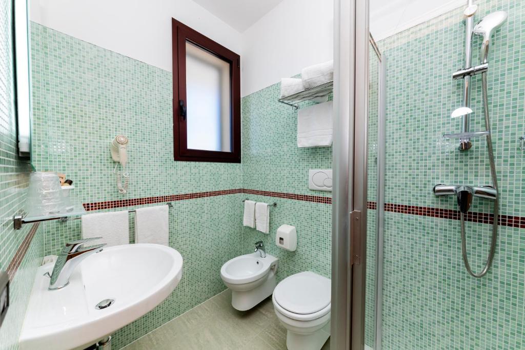 Koupelna v ubytování Hotel Alba