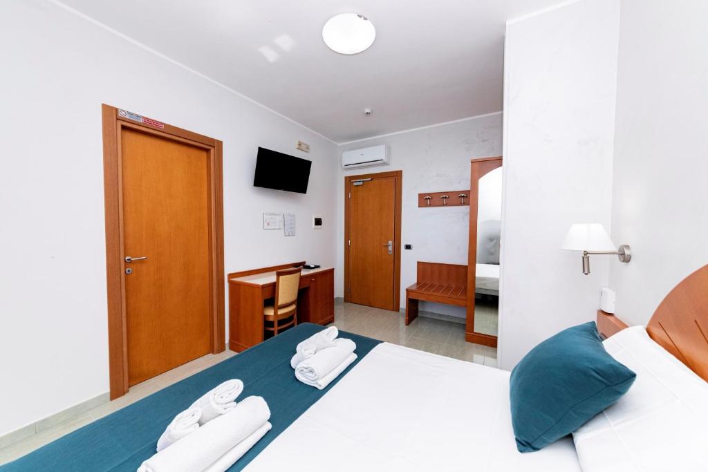 Postel nebo postele na pokoji v ubytování Hotel Alba