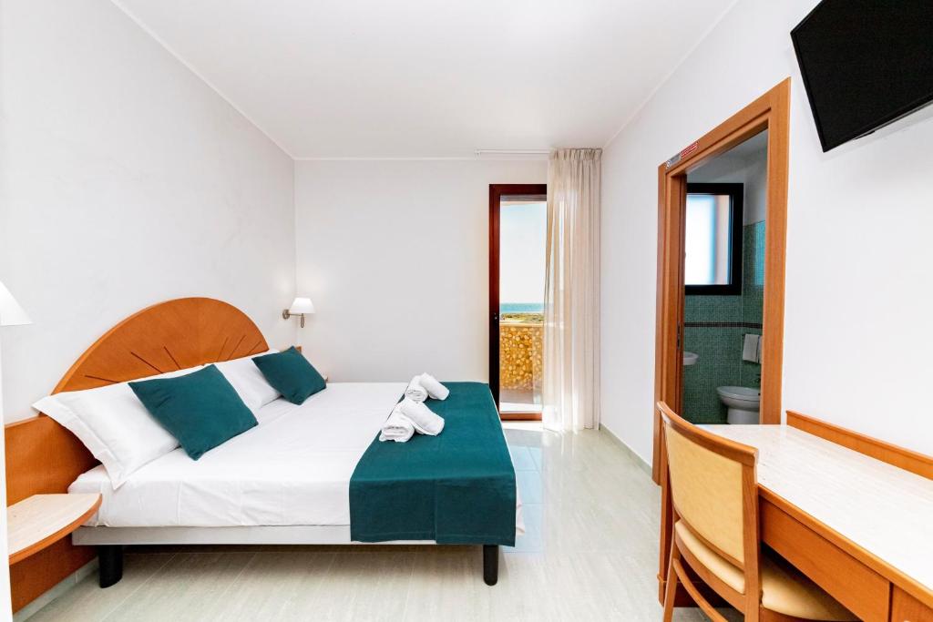 Postel nebo postele na pokoji v ubytování Hotel Alba